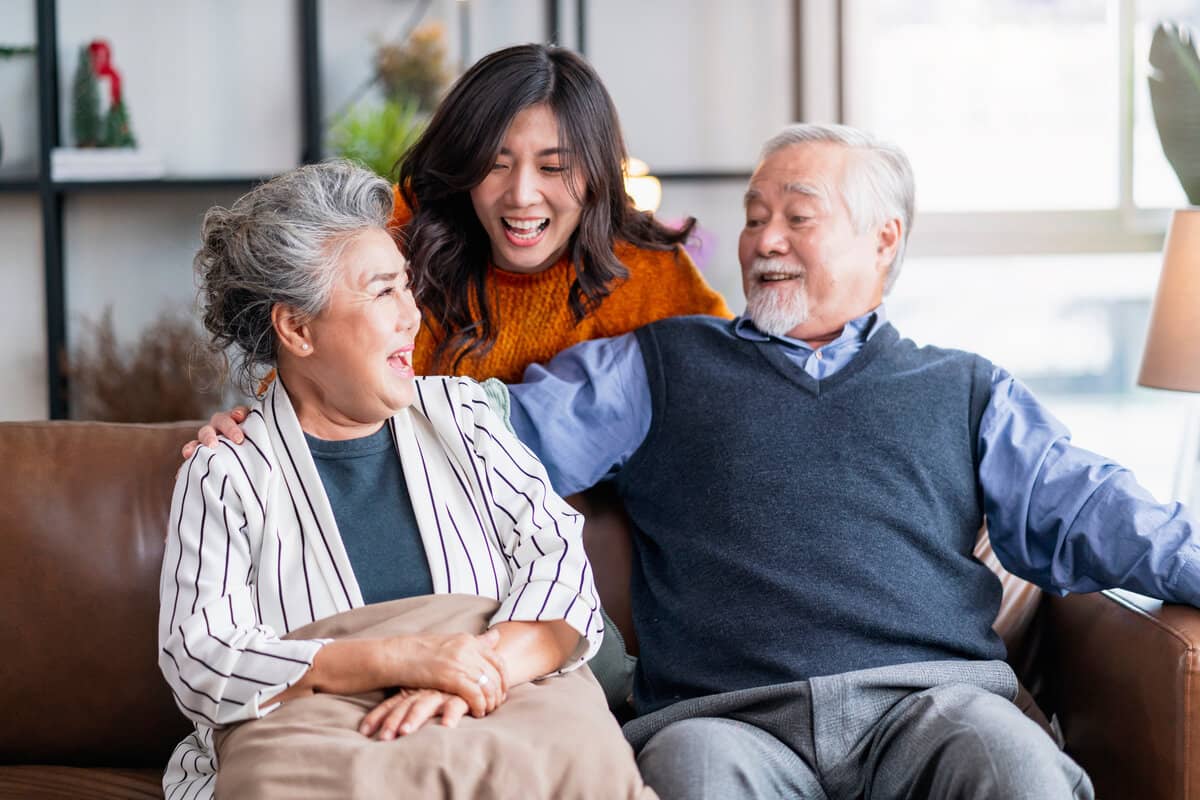 A daughter talking to her elderly parents