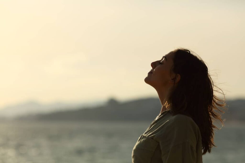 A woman doing deep breathing