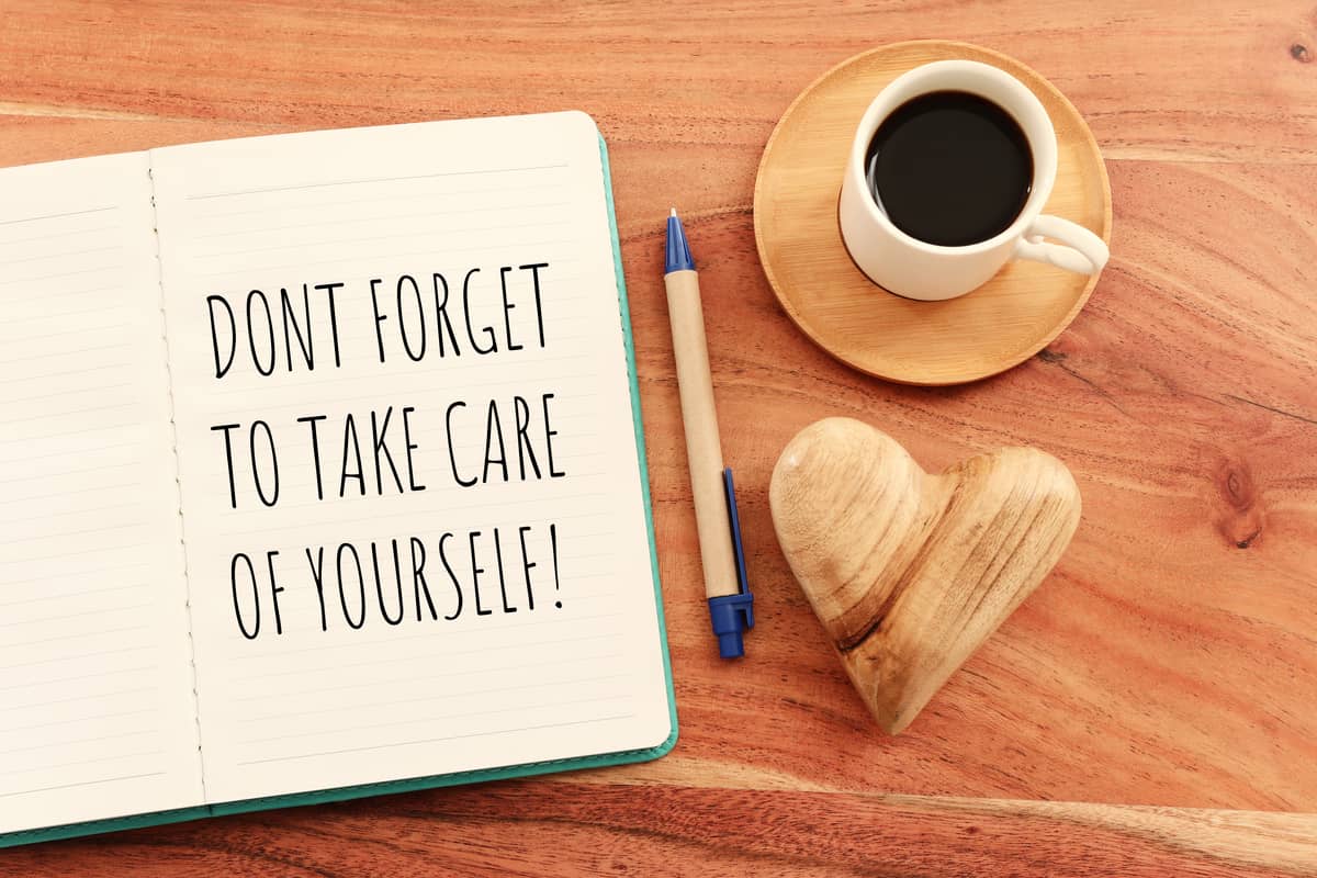 A notebook that says "Don't forget to take care of yourself!"